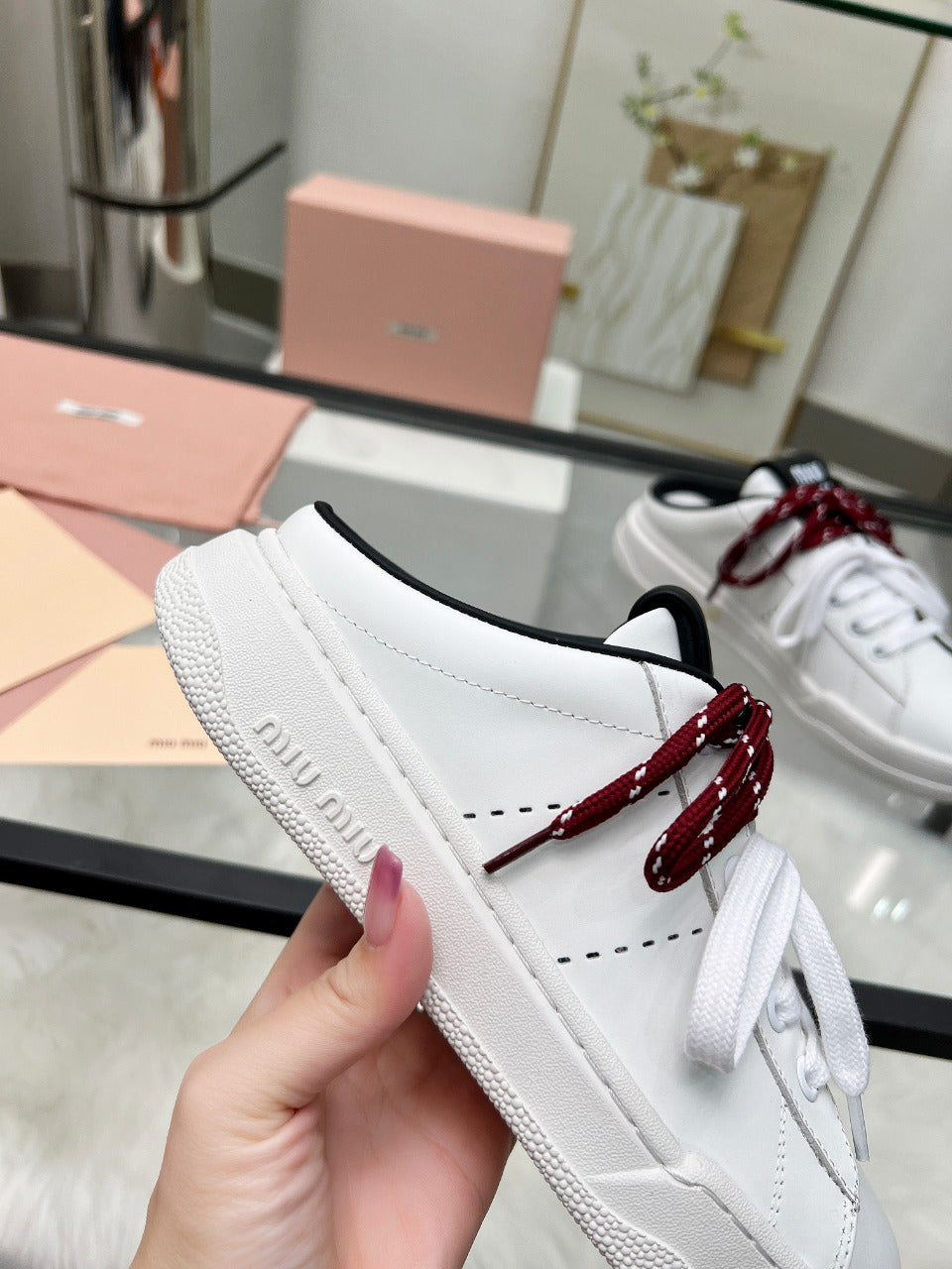 SNEAKER MULES IN BLACK AND WHITE CALFSKIN WHITE RED LACES